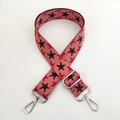 Close-up of star and bird pattern on adjustable wide knit crossbody bag strap - Pink Base Coffee Star Silver Buckle