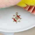 Golden rudder charm with red and white enamel and a sparkling center rhinestone - Red and White Ship Helm (7)