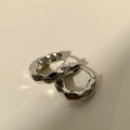 Macro detail of silver geometric earrings with irregular liquid lava texture finish - Bright Silver Irregular Lava Texture Hoop (A47 Silver)