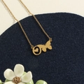 Elegant gold butterfly and heart pendant necklace with slim chain on a blue velvet base - Gold O