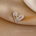 Elegant heart-shaped silver brooch with sparkling cubic zirconia on draped satin fabric - Silver