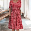 Detail of red short sleeve dress featuring white abstract prints and practical side pockets - Red Floral