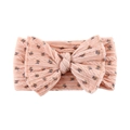 Detail of pink baby headband with large bow and blue floral texture on soft fabric - Pink With Blue Flowers