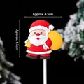 Christmas Santa Claus soft PVC cake topper holding a gift bag, 4.7cm festive ornament - Soft Glue Santa with Backpack / Approx. 4.5x4.7cm