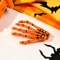 Detail of orange skeleton hand hair clip with metal alligator grip for Halloween - Orange