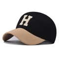 Close-up of washed cotton baseball cap featuring H letter towel embroidery and contrast brim - H Patchwork Black