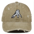 Close-up of distressed khaki baseball cap with vintage frayed edges and hand embroidery - One Size / Khaki