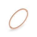Macro shot of rose gold bead bracelet with polished metal finish and hidden clasp - Rose Gold Beaded
