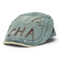 Detail of vintage washed denim flat cap with hand-painted graffiti letters and worn edges - Style C-Washed Blue (CHA)