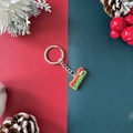 Porte-clés de Noël avec pendentif Merry Christmas rouge et vert et chapeau de fête - Étiquette Joyeux Noël