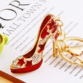 Exquisite gold high heel keychain with red enamel butterfly and sparkling rhinestones - Red Star High Heels