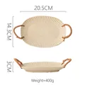 Handcrafted oval ceramic plate in oatmeal beige with radial texture and rattan handles - Light Chrysanthemum Plate with Rope