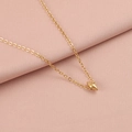 Detail view of a gold-tone seashell pendant necklace on soft pink textured fabric - 18K Gold Plated 6#