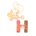 Letter H keychain pendant with colorful sequins and golden butterfly charm in resin - Letter H