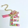Letter E keychain with pink tassel, butterfly charm and colorful heart sequins - Letter E