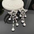 Boucles d'oreilles étoile argentées avec zircons scintillants et pompons longs - Boucles d'Oreilles Étoile à Franges Blanches