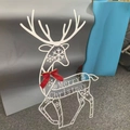 White Christmas reindeer metal ornament featuring snowflake patterns and festive bow - Medium Standing Deer B