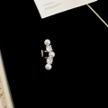 Detailed close-up of pearl and zircon ear cuff with silver setting on black background - Pearl Zirconia Row Set (HE29908-1) / Silver