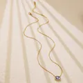 Detail of gold chain necklace featuring a purple rectangular gemstone and lobster clasp - Purple Rectangular Style (BD025-Purple)