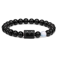 Libra zodiac beaded bracelet with polished black stones and light blue accent bead - Libra