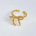 Golden bow-shaped open ring with sparkling crystal rhinestones and adjustable design - Gold Plated White Zirconia Bow Open Ring (B565)