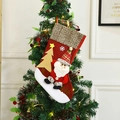 Christmas stocking featuring 3D Santa and gold tree hanging on a decorated tree - Santa Claus