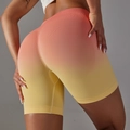 Detail of high-waisted seamless yoga shorts featuring a vibrant orange and yellow gradient - Rose Yellow