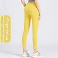 Hoch taillierte, ingwergelbe Fitness-Leggings mit Seitentaschen und Peach-Lift-Design - S / Ingwergelb