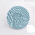 Blue round silicone makeup brush cleaning mat with various textures and suction cups - Round Shape / Blue
