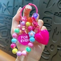 Vibrant colorful beaded keychain featuring a large pink heart and a FOR EVER charm. - Colorful Beaded Heart Pendant / Rose Red