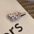 Detail of pink crystal bow hair clip with silver alloy finish and sparkling rhinestones - Rhinestone Bow Duckbill Clip