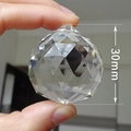 Close-up of a 30mm faceted clear crystal ball pendant for chandeliers and DIY decor - Spherical Transparent (30mm)