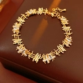 Detail view of gold square link bracelet with cubic zirconia and lobster clasp - Bracelet - Gold