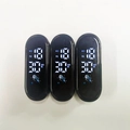 Three waterproof LED digital watch heads with white display showing time and battery icon - Mi 8 Astronaut Module