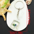 Resin tropical fish water bag keychain in blue gradient with dimensions 8.7x3cm - Keychain / Blue Green Fish Keychain