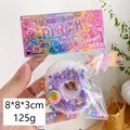 Lila Donut-Stressball-Spielzeug, 125g Quetschspielzeug mit Pailletten, 8x8x3cm - Weißer Donut mit Biss