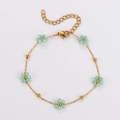 Golden bead chain bracelet with light green flower charms on a clean white background - Lime Green-Bracelet