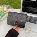 Elegant black sequin crossbody bag with gold chain strap and dual-ring metal lock - Black