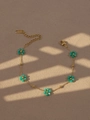 Bohemian stainless steel bracelet featuring green beaded flowers on a golden link chain - Blue Green Bracelet