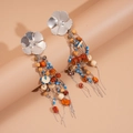 Ethnic flower earrings with colorful beads and silver tassels on a warm background - Silver (Silver Pin)