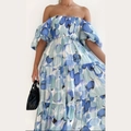 Detalle de las mangas abullonadas y el estampado bohemio de lunares azules del vestido - S / Puntos Azul Blanco