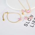 Close-up of pink butterfly jewelry set including gold necklace, bracelet, ring and earrings - Purple Butterfly Set