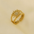 Detailed view of 18K gold sunflower ring with translucent stone on silk background - Gold/Light Yellow Stone