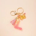 Pink glitter resin letter L keychain with suede tassel and metal butterfly pendant - Letter L