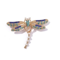 Detail view of dragonfly brooch with blue crystals and white pearls on gold plating - Style 10