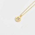 Minimalist gold necklace featuring a round pendant with sparkling crystal letter N - Letter N