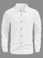 Detailed texture of white linen fabric with dark brown buttons and a single chest pocket - White