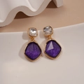 Close-up of vintage geometric earrings with square clear and purple resin stones - Purple