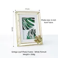 Vertical white 6-inch metal photo frame with golden ginkgo leaf and minimalist design - Ginkgo Leaf Frame-White Vertical 6-inch