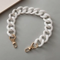 Macro shot of chunky pearlescent white resin chain strap with gold lobster clasps - Porcelain White